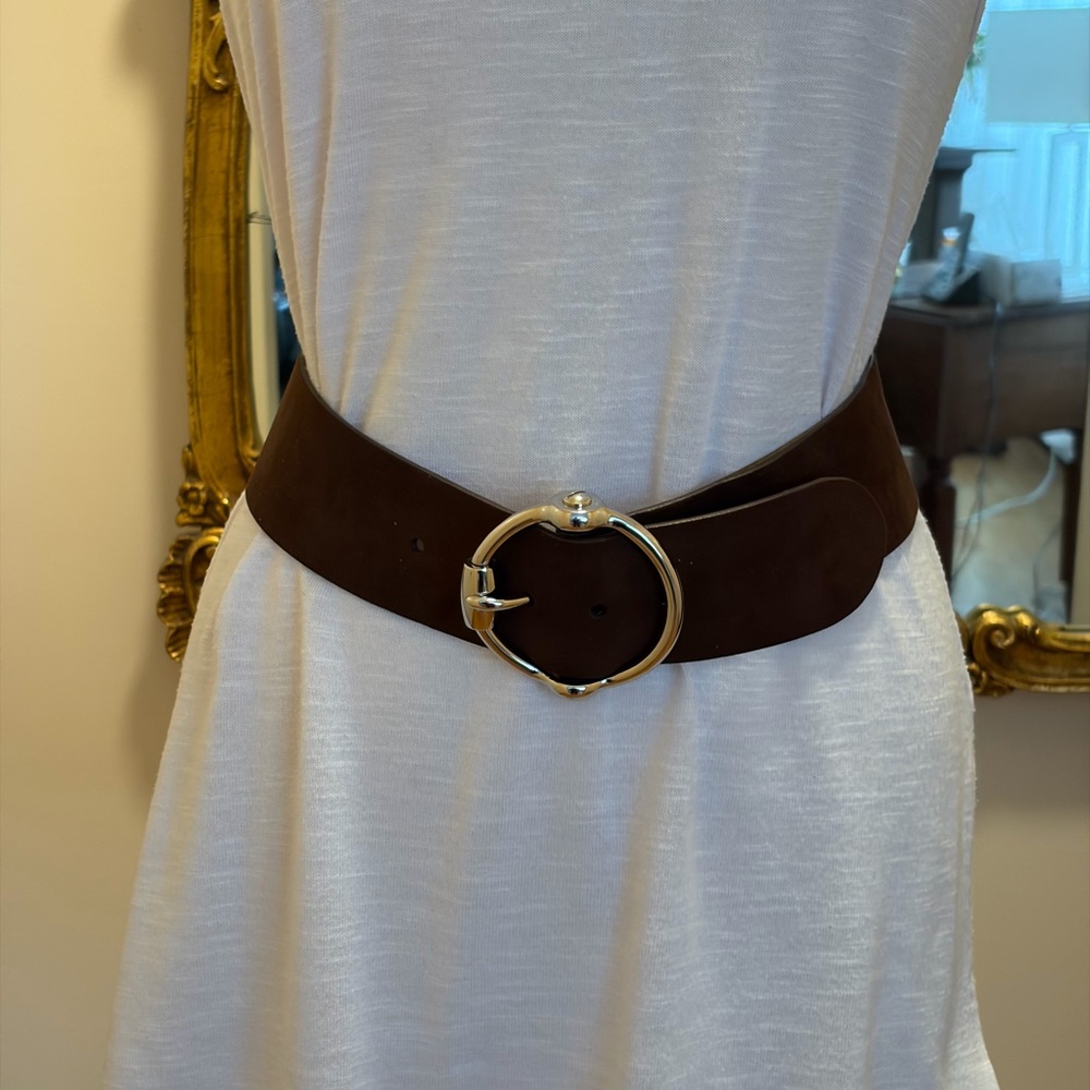 A Ralph Lauren brown suede belt with circular silver metal buckle